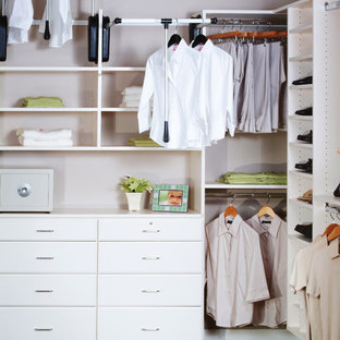 Example of a large trendy gender-neutral carpeted dressing room design in Other with raised-panel cabinets and white cabinets