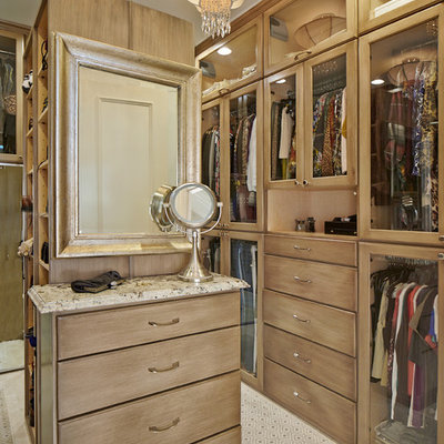 Inspiration for a timeless dressing room remodel in Dallas with medium tone wood cabinets