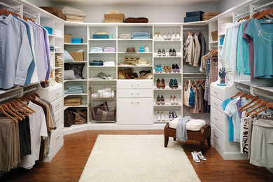 Large minimalist gender-neutral medium tone wood floor walk-in closet photo in Other with open cabinets and white cabinets