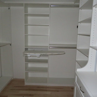 Example of a small transitional gender-neutral light wood floor and beige floor walk-in closet design in Philadelphia with open cabinets and white cabinets
