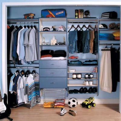 Large elegant men's light wood floor reach-in closet photo in New York with open cabinets and blue cabinets