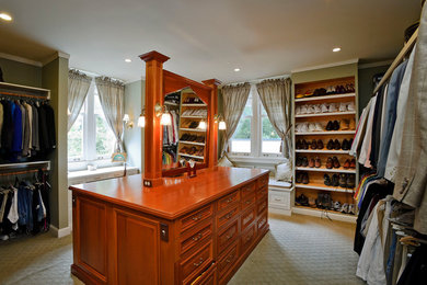 Large trendy carpeted and white floor closet photo in Orlando with raised-panel cabinets and brown cabinets