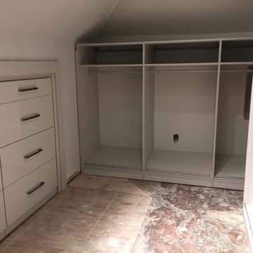 Contemporary Master Closet in high-gloss white and linen finish