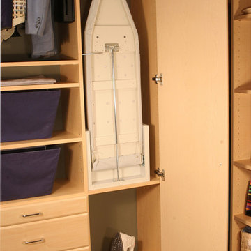 Custom closet with a built in ironing board and hidden!