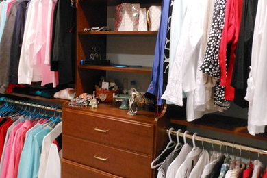 Example of a classic closet design in Other