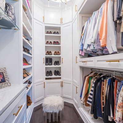 Example of a transitional gender-neutral dark wood floor and brown floor walk-in closet design in Houston with open cabinets and white cabinets