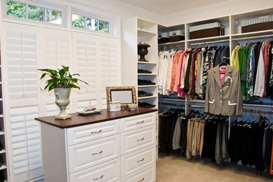 Elegant closet photo in New Orleans with white cabinets