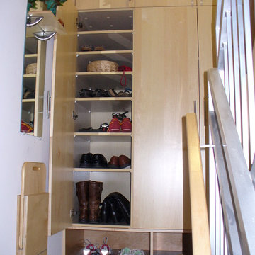 Custom mudroom storage shelves and fold down bench