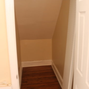 Deep Narrow Angled Ceiling Walk in Closet
