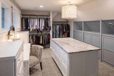 Large transitional gender-neutral carpeted walk-in closet photo in Minneapolis with shaker cabinets and white cabinets