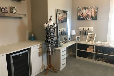 Example of a mid-sized transitional women's carpeted and gray floor dressing room design in Las Vegas with raised-panel cabinets and light wood cabinets