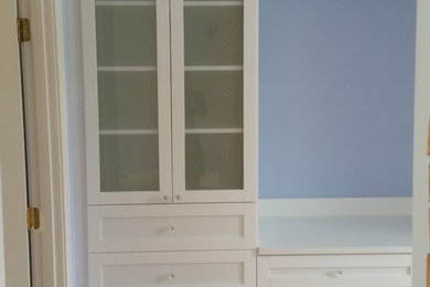 Inspiration for a small transitional women's dressing room remodel in New York with white cabinets and shaker cabinets