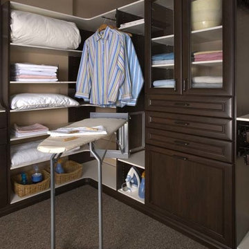 Fold Away Ironing Board and Glass-front Custom Closet Cabinets