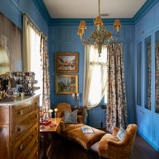 Closet - traditional dark wood floor and brown floor closet idea in New Orleans with recessed-panel cabinets and blue cabinets