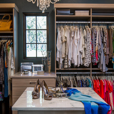 Inspiration for a large transitional women's carpeted dressing room remodel in Austin with open cabinets and light wood cabinets
