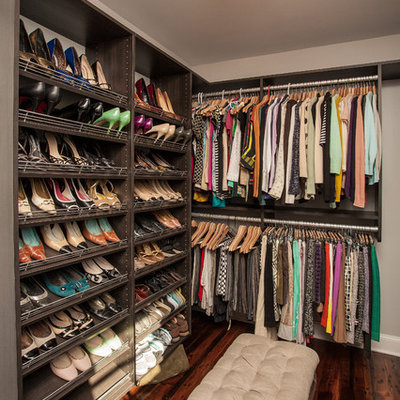 Example of a trendy dressing room design in Atlanta with open cabinets and dark wood cabinets