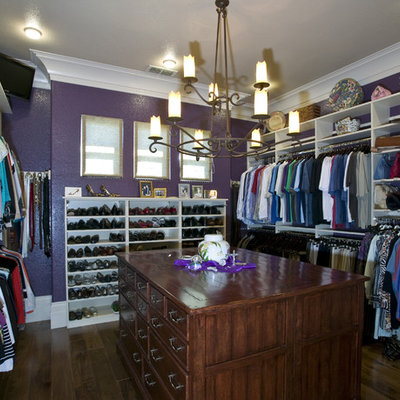 Mid-sized trendy gender-neutral brown floor and dark wood floor walk-in closet photo in Sacramento with raised-panel cabinets and white cabinets