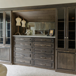 Large transitional gender-neutral carpeted dressing room photo in Richmond with medium tone wood cabinets