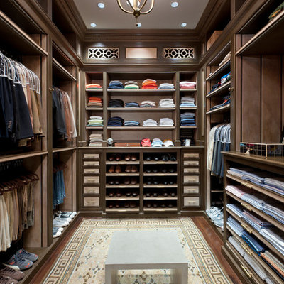 Inspiration for a large timeless men's dark wood floor walk-in closet remodel in Miami with open cabinets and dark wood cabinets