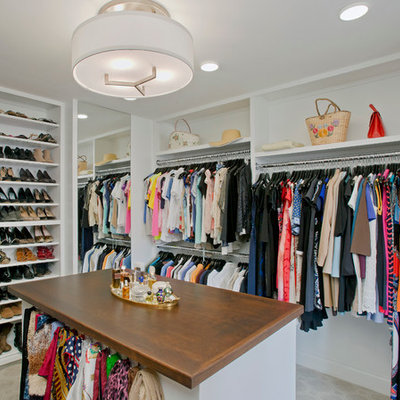 Large elegant women's carpeted walk-in closet photo in Baltimore with white cabinets and open cabinets