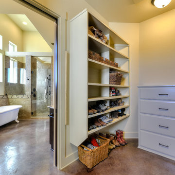 Large Walk-in Closet with built-in shelves and dresser