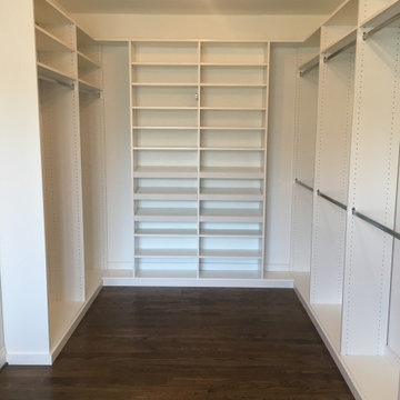Large Walk-in Closet with Hallway Storage cabinets and custom dressers
