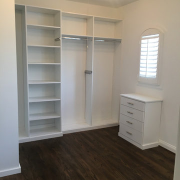 Large Walk-in Closet with Hallway Storage cabinets and custom dressers