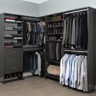 Example of a mid-sized minimalist dressing room design in Toronto with flat-panel cabinets and gray cabinets