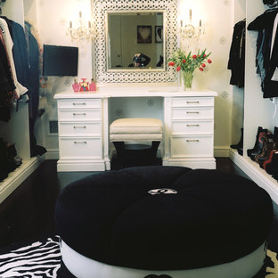 Dressing room - large transitional women's dark wood floor dressing room idea in New York with flat-panel cabinets