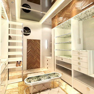 Ispirazione per una cabina armadio unisex design di medie dimensioni con ante lisce, ante bianche, pavimento in marmo, pavimento beige e soffitto in perlinato