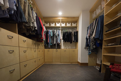 Walk-in closet - mid-sized modern gender-neutral porcelain tile and gray floor walk-in closet idea in Other with flat-panel cabinets and light wood cabinets