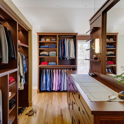 Inspiration for a large timeless gender-neutral light wood floor dressing room remodel in Boston with shaker cabinets and medium tone wood cabinets