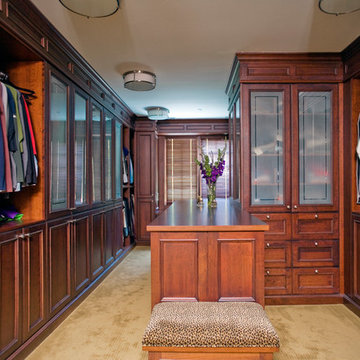 Master closet and dressing room features rich cherry cabinetry and center island
