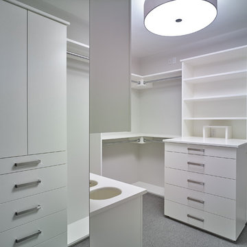 Master closet with drawers and laundry cubbies