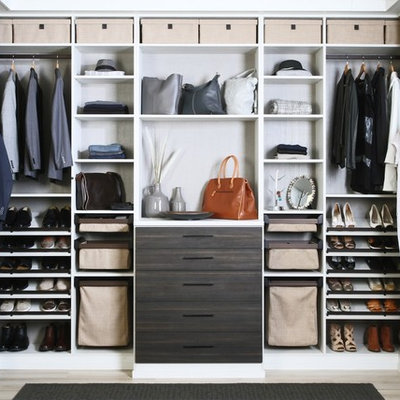 Walk-in closet - contemporary gender-neutral light wood floor and beige floor walk-in closet idea in Dallas with open cabinets and brown cabinets