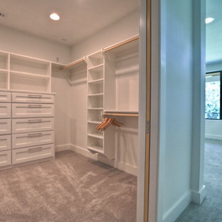 Inspiration for a contemporary closet remodel in Houston with white cabinets