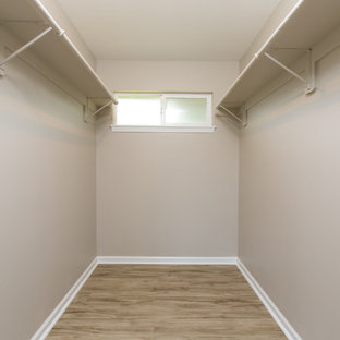 Walk-in closet - small transitional gender-neutral medium tone wood floor and brown floor walk-in closet idea in Hawaii