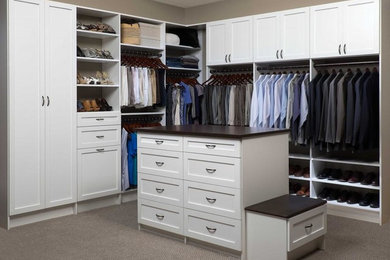 Example of a large trendy gender-neutral carpeted and gray floor walk-in closet design in Philadelphia with white cabinets and shaker cabinets