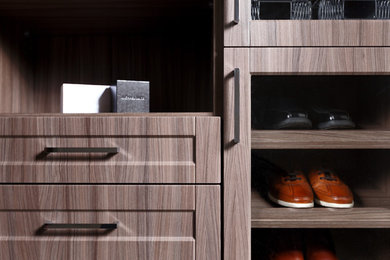 Large trendy gender-neutral walk-in closet photo in Vancouver with shaker cabinets