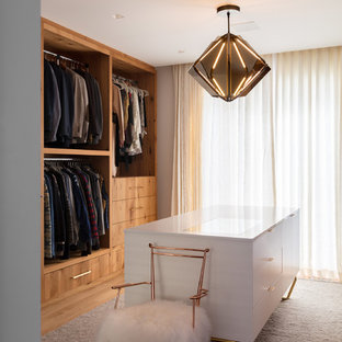 Inspiration for a large contemporary gender-neutral brown floor and light wood floor dressing room remodel in Other with flat-panel cabinets and medium tone wood cabinets