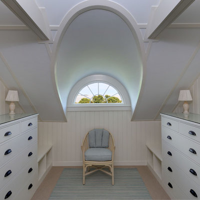 Small elegant gender-neutral carpeted dressing room photo in Portland Maine with flat-panel cabinets and white cabinets