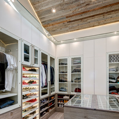 Inspiration for a contemporary men's dark wood floor and beige floor walk-in closet remodel in Salt Lake City with flat-panel cabinets and white cabinets