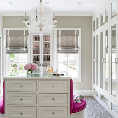 Example of a large transitional women's carpeted and gray floor walk-in closet design in Little Rock with recessed-panel cabinets and white cabinets