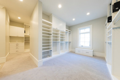 Dressing room - huge traditional gender-neutral carpeted and white floor dressing room idea in Salt Lake City with flat-panel cabinets and white cabinets