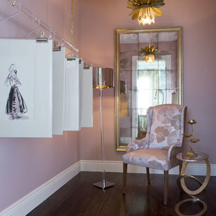 Example of a mid-sized classic women's dark wood floor walk-in closet design in San Francisco