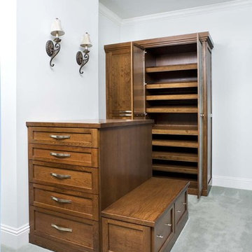 Shaker style enclosed closet with island and bench