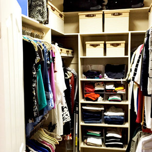 Small elegant gender-neutral carpeted walk-in closet photo in Boise with open cabinets and white cabinets