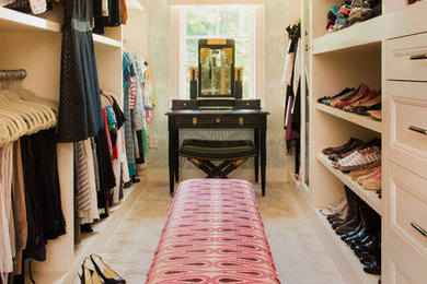 Walk-in closet - large contemporary women's carpeted walk-in closet idea in Boston with open cabinets and light wood cabinets