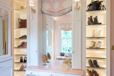 Elegant medium tone wood floor closet photo in Richmond with shaker cabinets and white cabinets