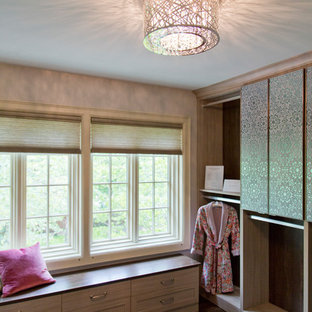 Dressing room - large transitional gender-neutral dark wood floor and brown floor dressing room idea in Kansas City with flat-panel cabinets and light wood cabinets